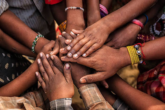 Sadaiv Yuva Foundation volunteers standing together in a village beneath the foundation banner